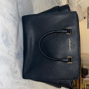 Michael Kors bag, black in color. Excellent condition.Comes with duster bag.